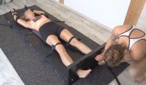 Jennie Drives Alisee Crazy in the Stocks